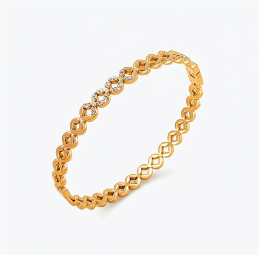 crystal infinity golden bracelet on a white background