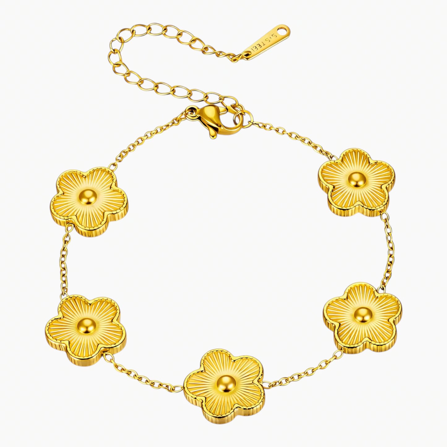 Gold bracelet with floral designs on a white background