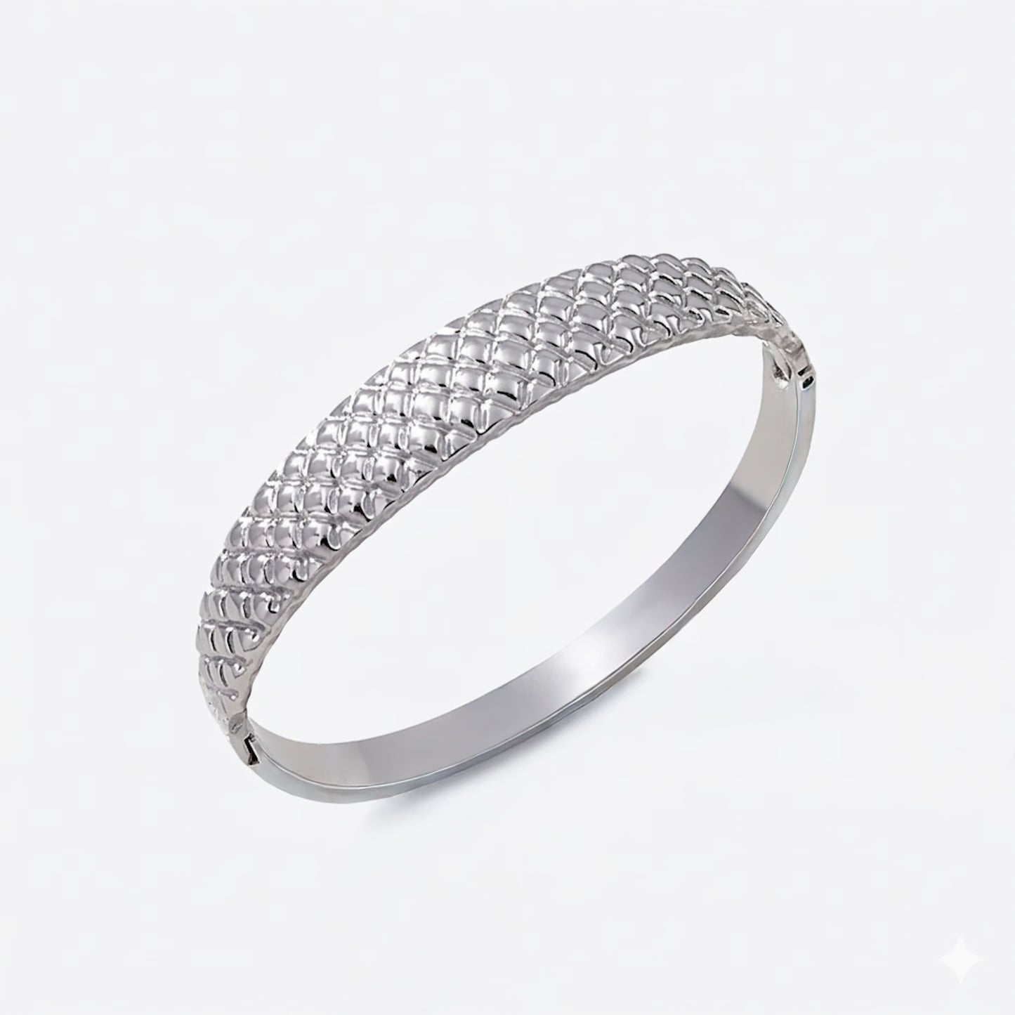 Silver bracelet with cushion textured design on a white background