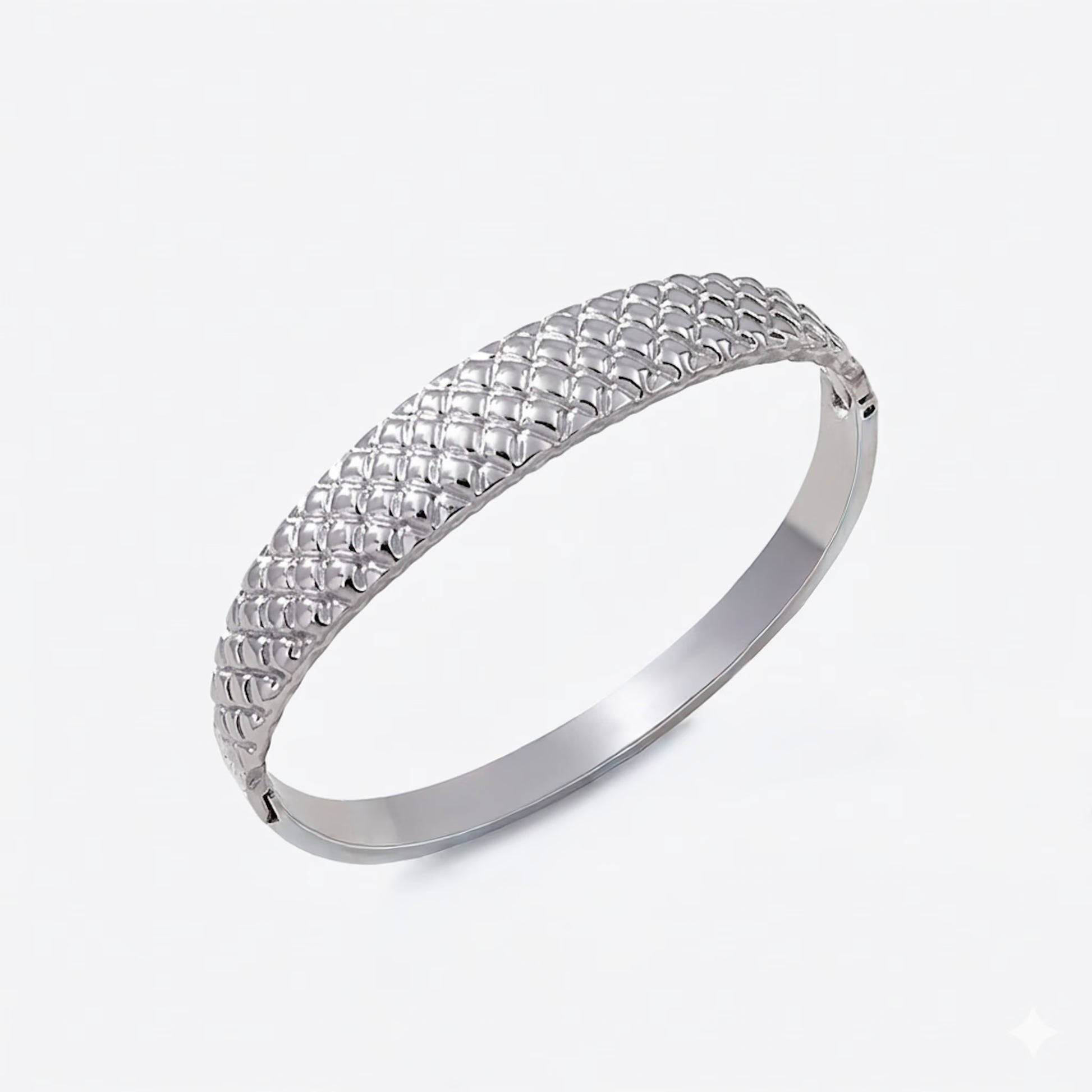 Silver bracelet with cushion textured design on a white background