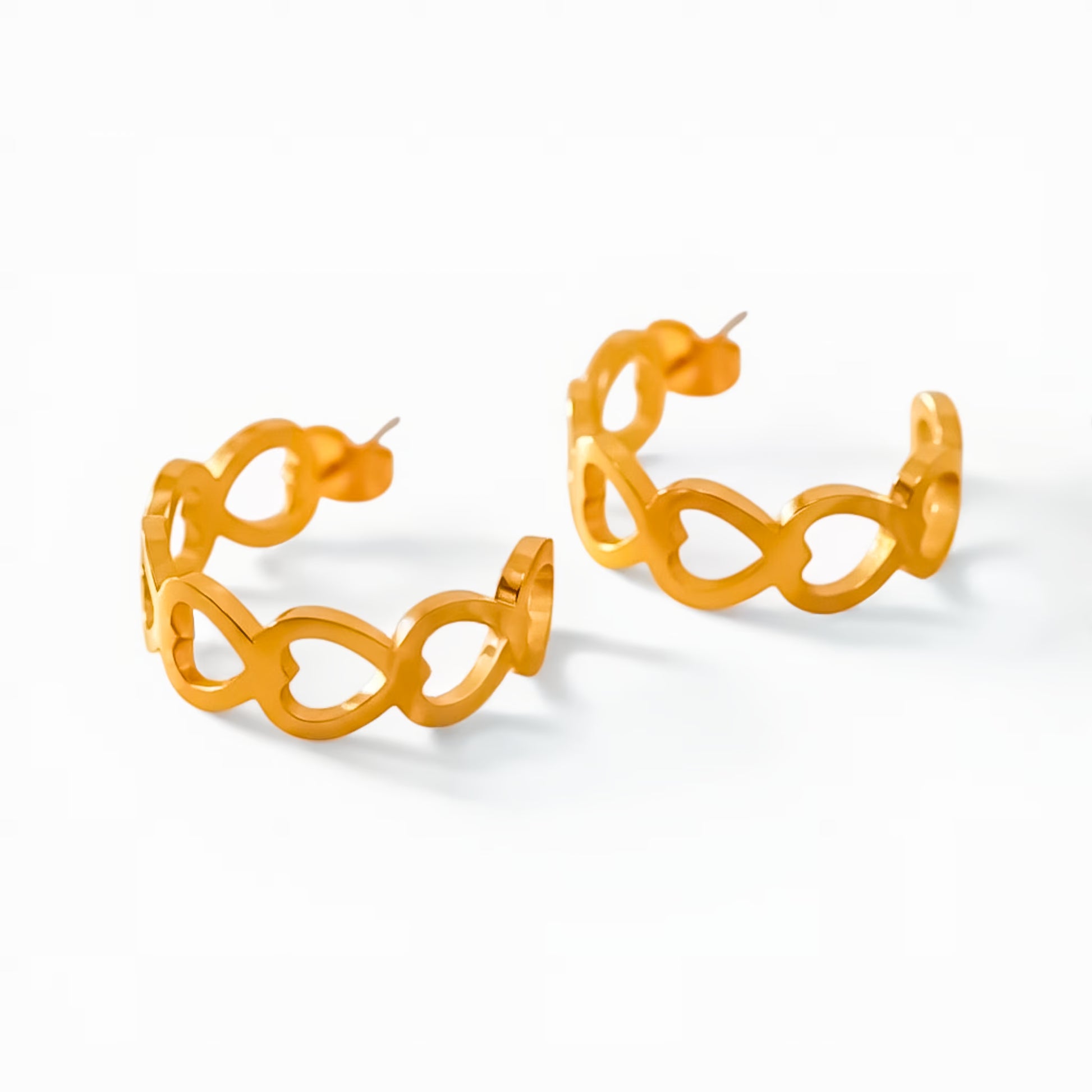 Pair of gold hoop earrings on a white background