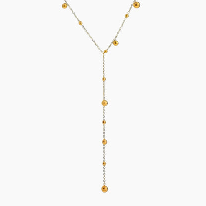 Necklace with alternating gold and silver beads on a white background