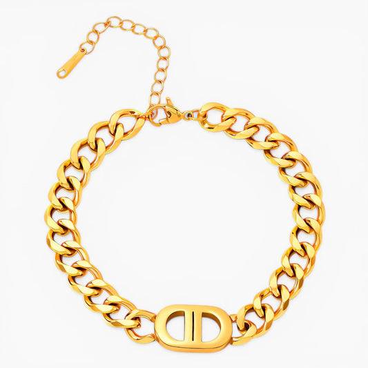 Gold cuban chain necklace on a white background