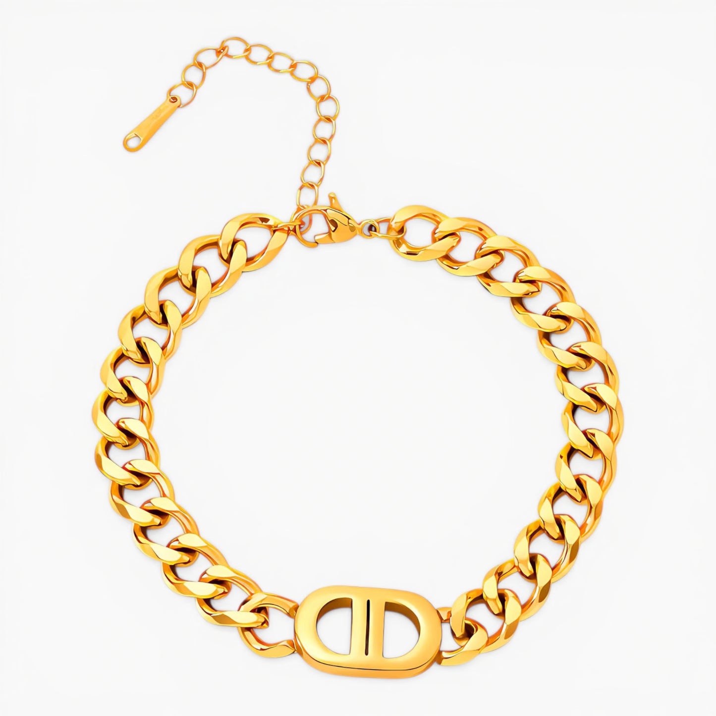 Gold link chain bracelet with a clasp on a white background