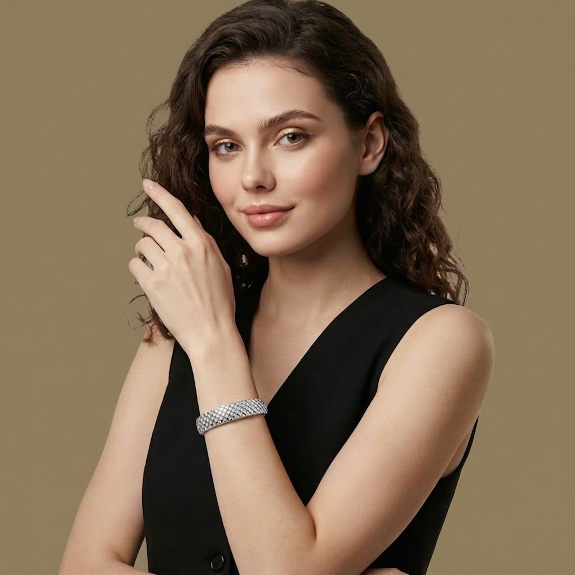 Woman in black wearing a cushion textured silver bangle