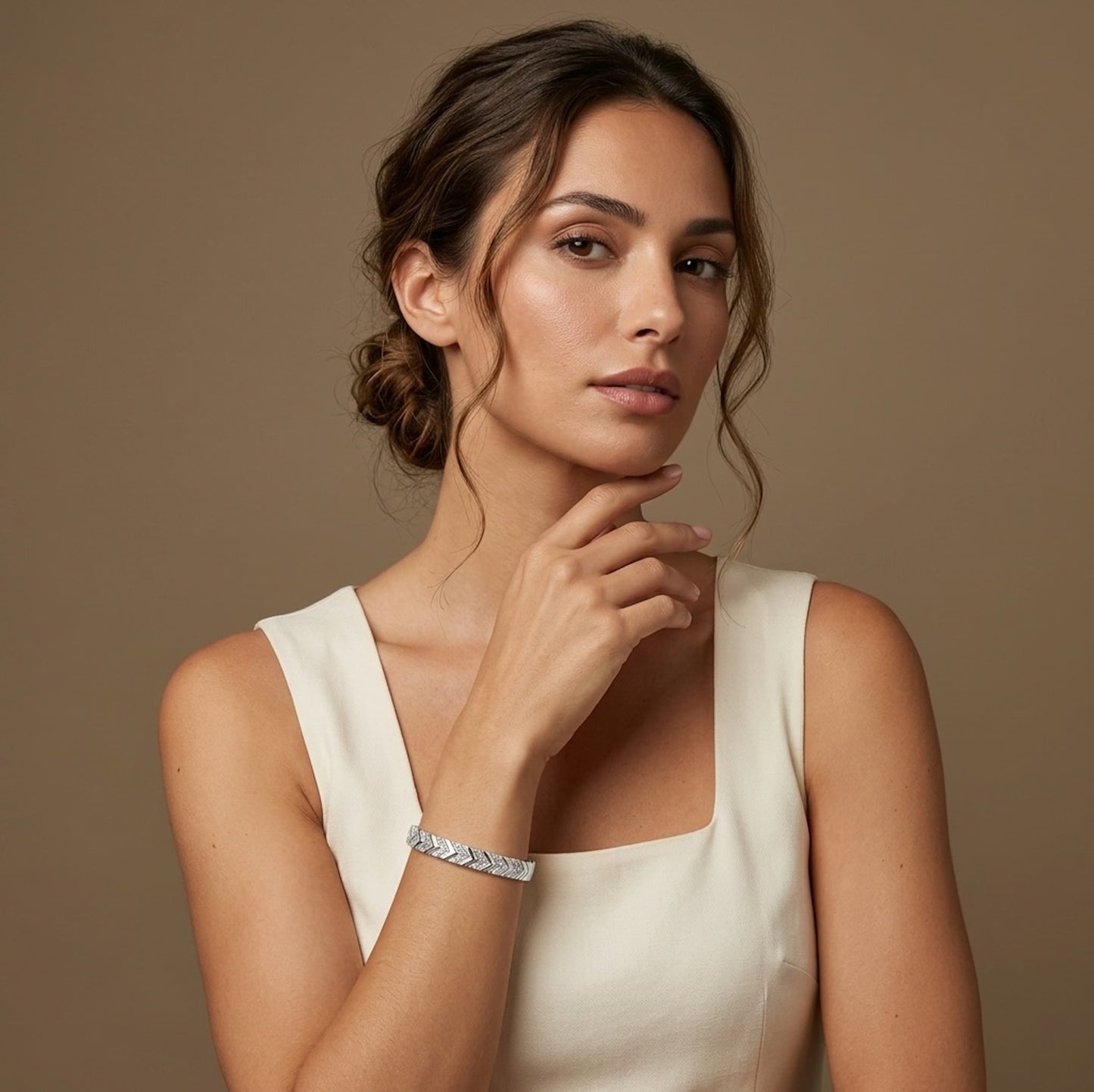 Woman wearing a white sleeveless top against a golden background