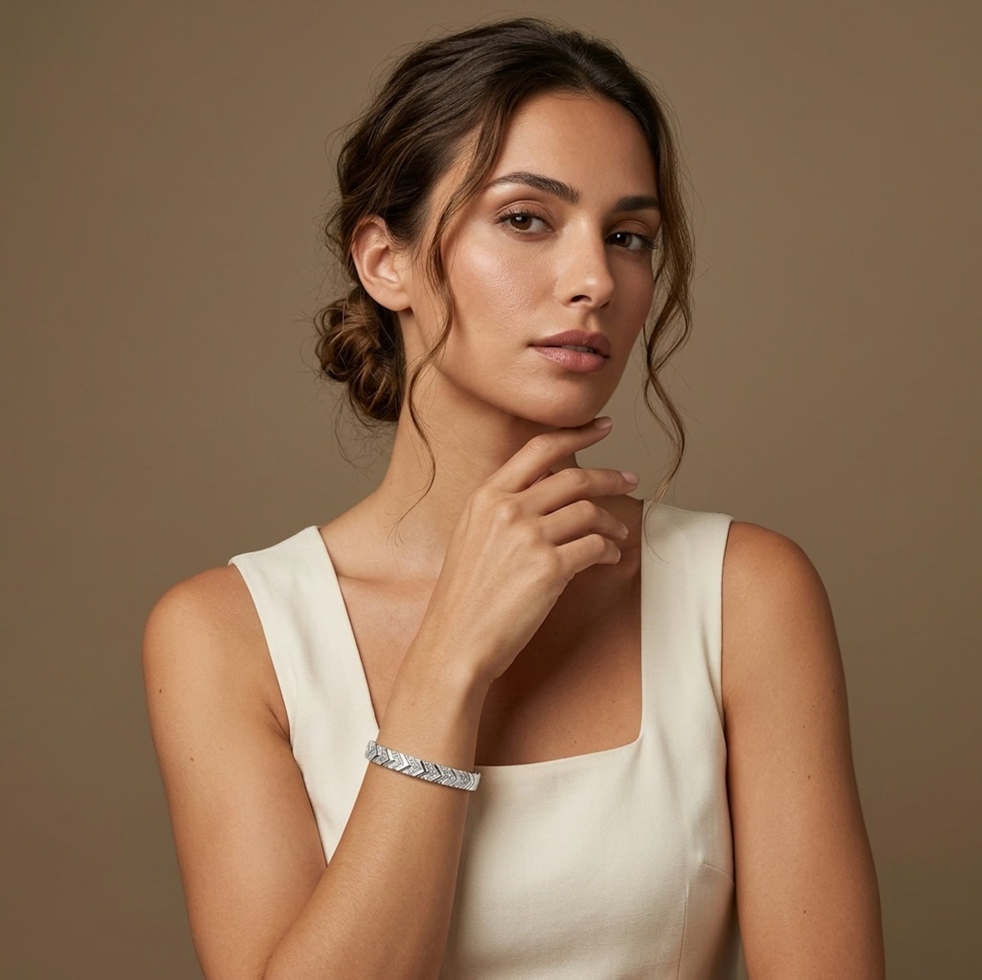 Woman wearing a white sleeveless top against a golden background