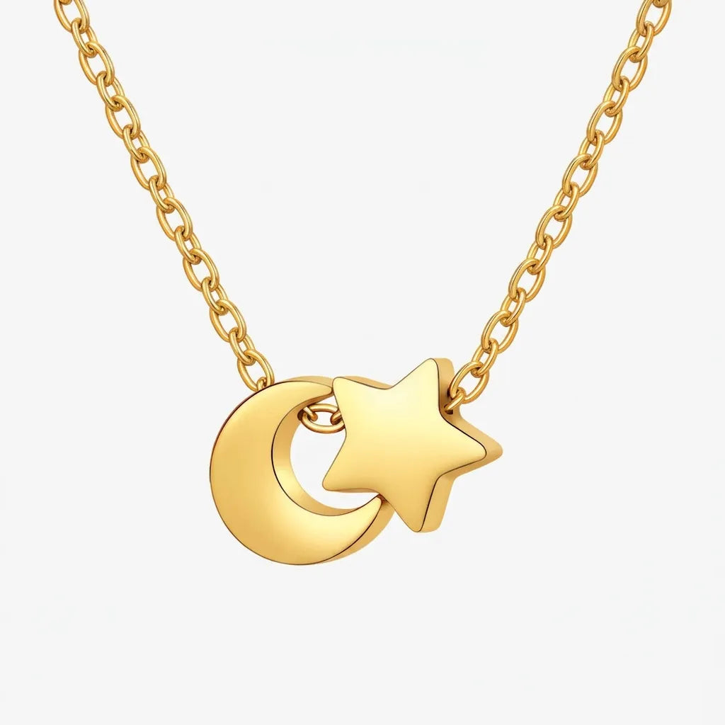 Gold necklace with a moon and star pendant on a white background