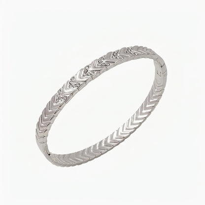 Silver bracelet with letter V design on a white background